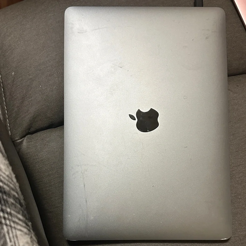 Apple MacBook with Black and Silver Design